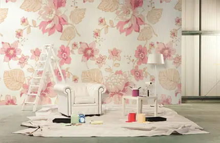 Room with paint pots and white armchair